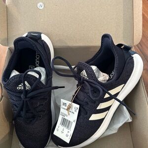 Adidas women’s Cloudfoam Navy slip on Sneakers